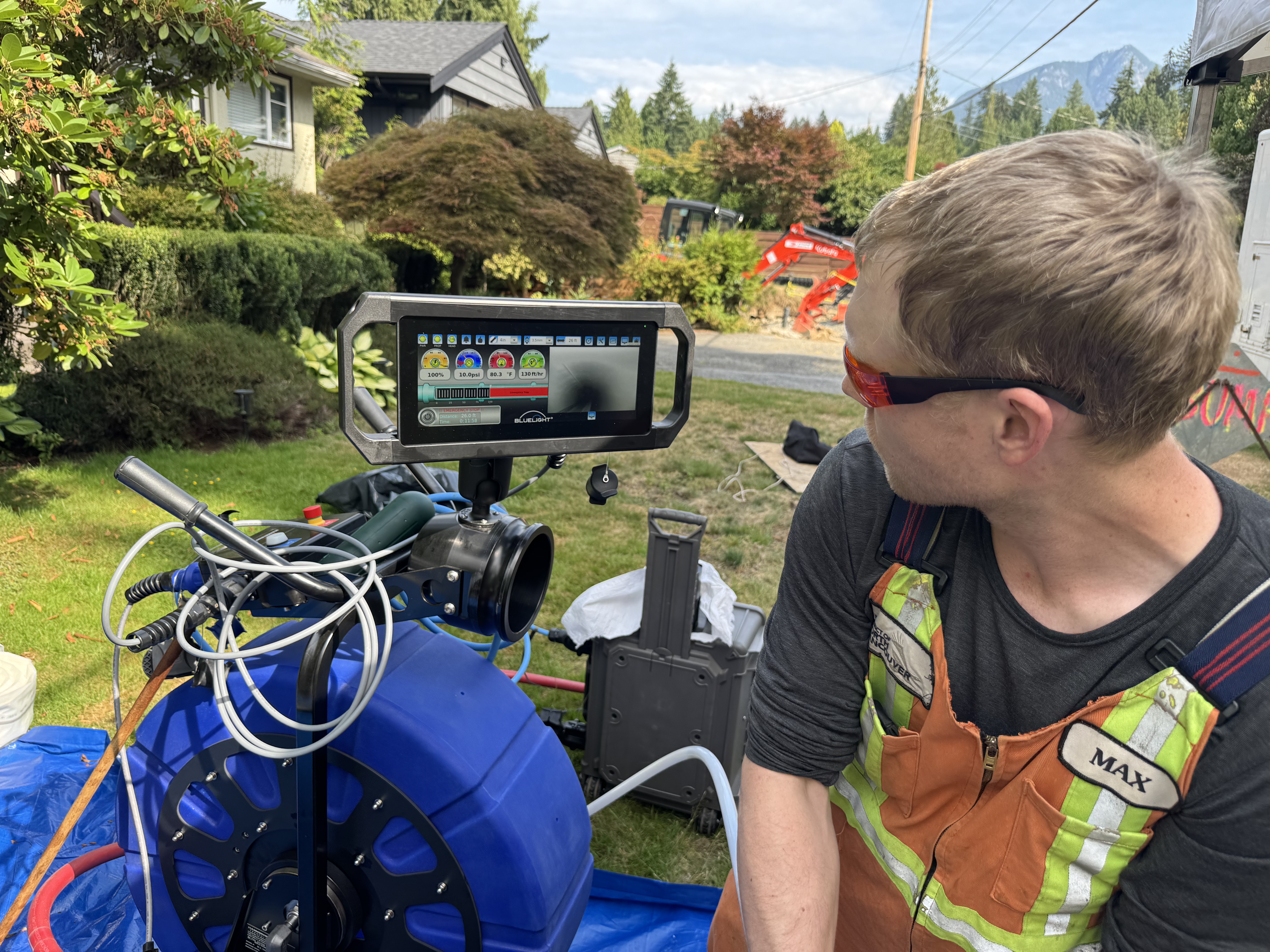 Bluelight system in the field with a man watching the screen