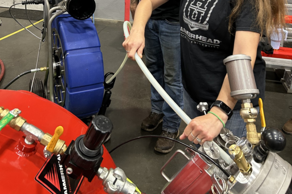 In HammerHead University, a woman guiding the automated pullback.